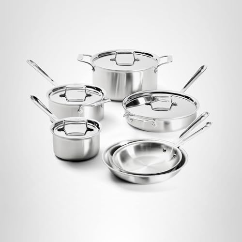 Set of stainless steel cookware with lids on a light gray background