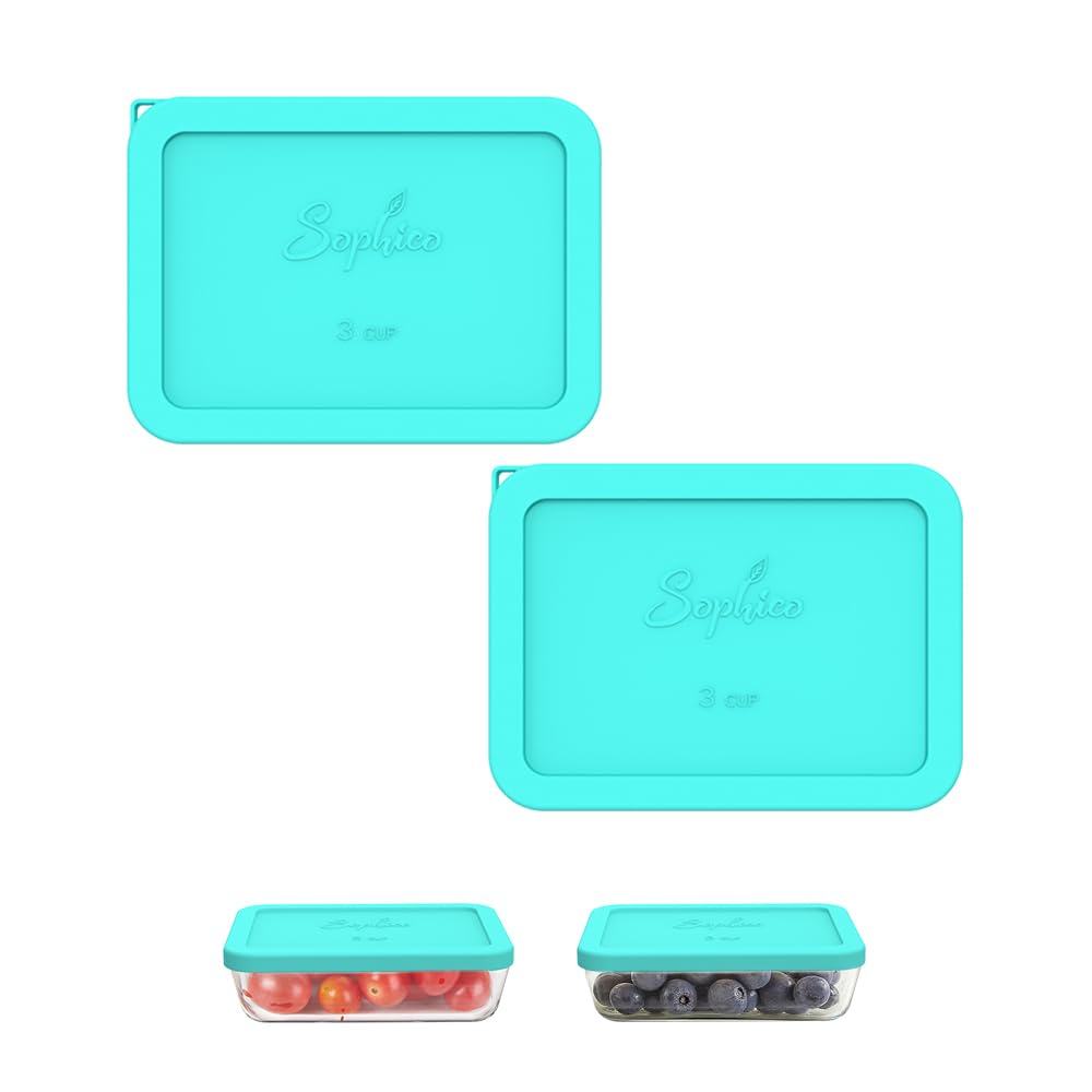 Set of teal silicone food containers with lids on a white background