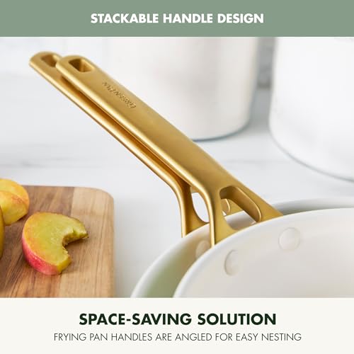 Stackable handle design of a frying pan with apples on a cutting board in the background.