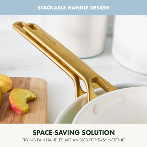 Stackable handle design of a frying pan with apples on a cutting board in the background.