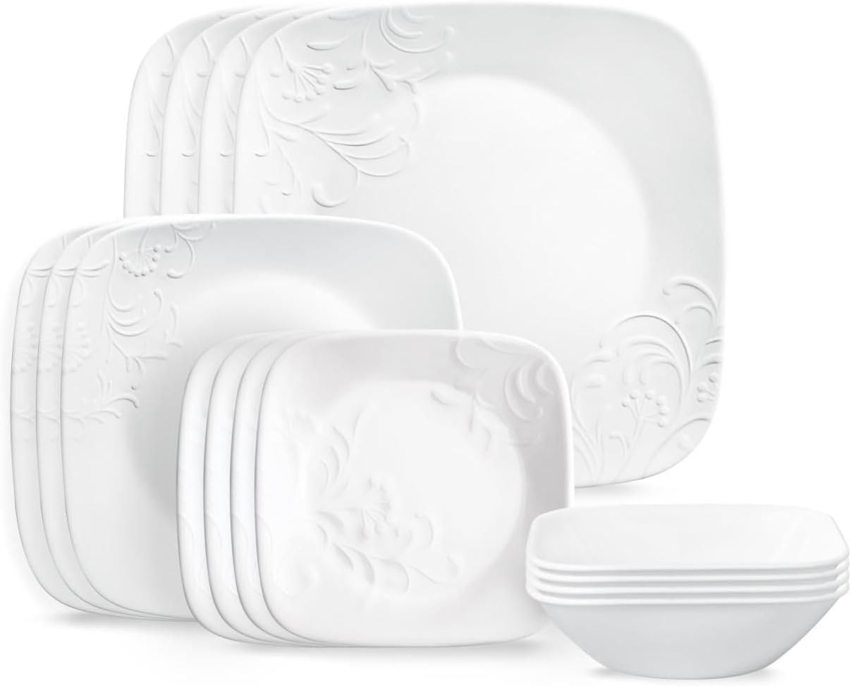 Set of white Corelle cherish dinnerware with embossed design on a white background