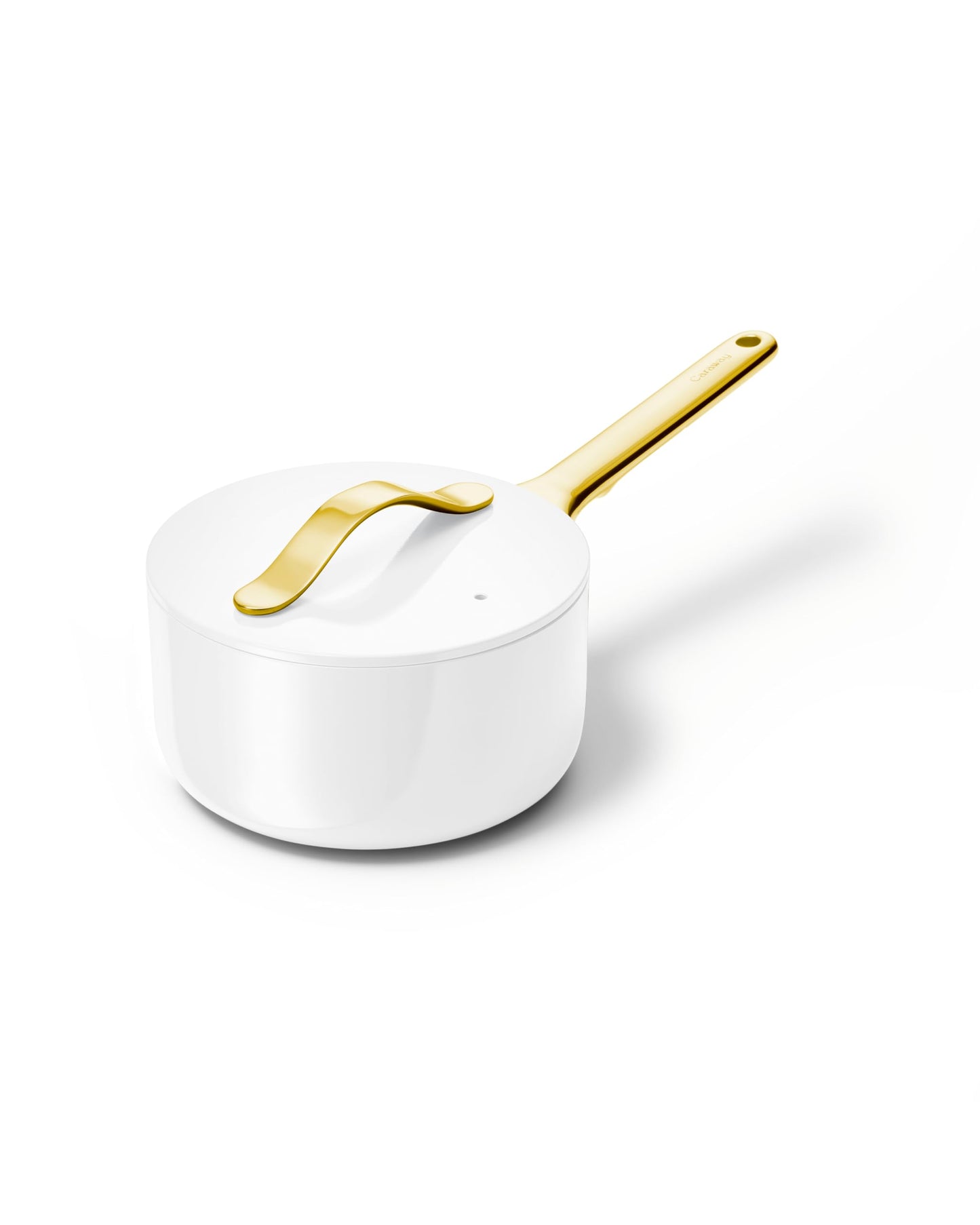 White saucepan with a gold handle on a white background