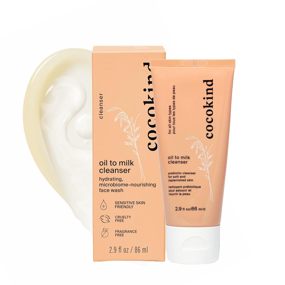 Cocokind oil to milk cleanser with a white container on a white background