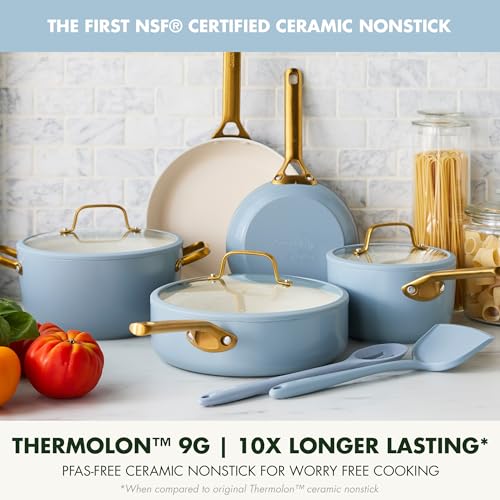 Set of blue ceramic cookware with gold handles on a kitchen counter, featuring Thermolon 9G branding.