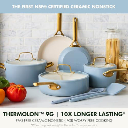 Set of blue ceramic cookware with gold handles on a kitchen counter, featuring Thermolon 9G branding.