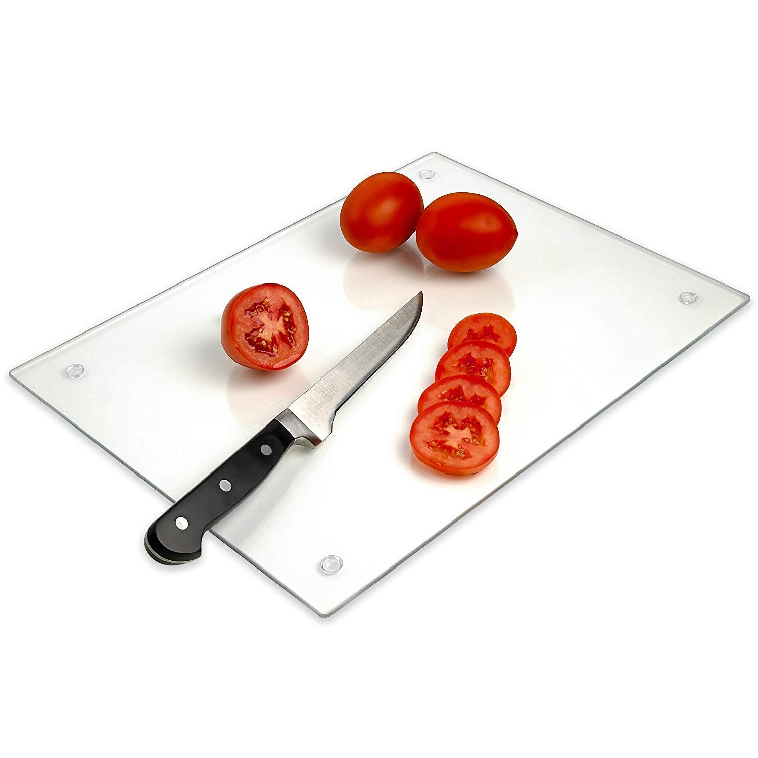 Tempered glass cutting board with sliced tomatoes and a knife on a white background
