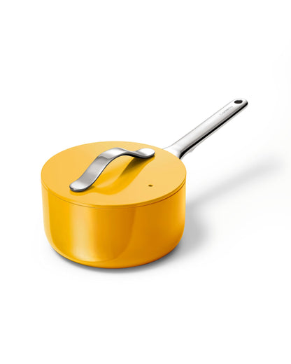 Yellow saucepan with a silver handle on a white background