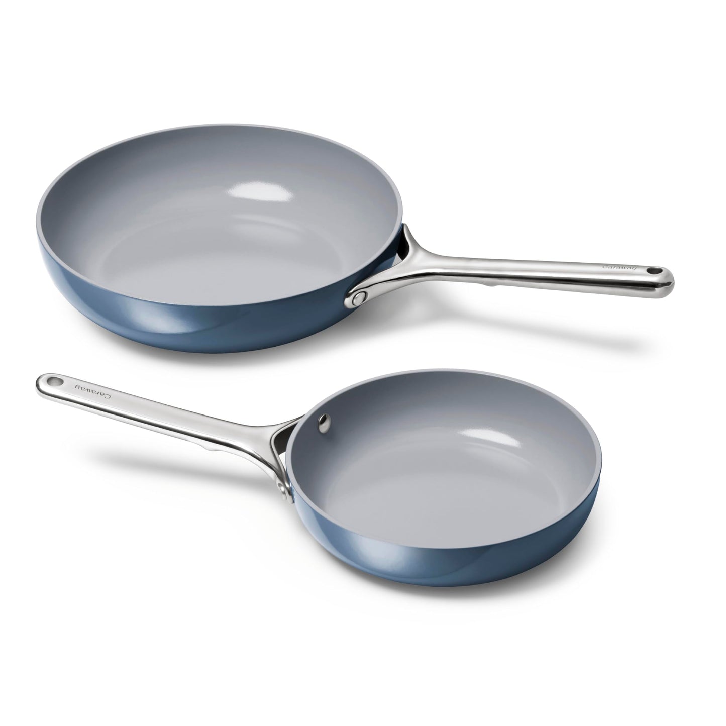Two blue ceramic cookware pans on a white background
