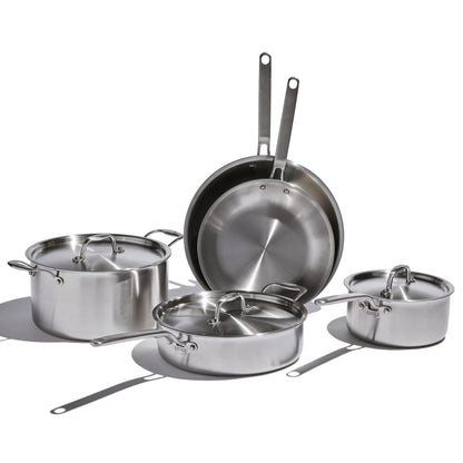 Set of stainless steel cookware on a white background