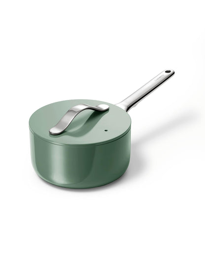 Green saucepan with a silver handle on a white background