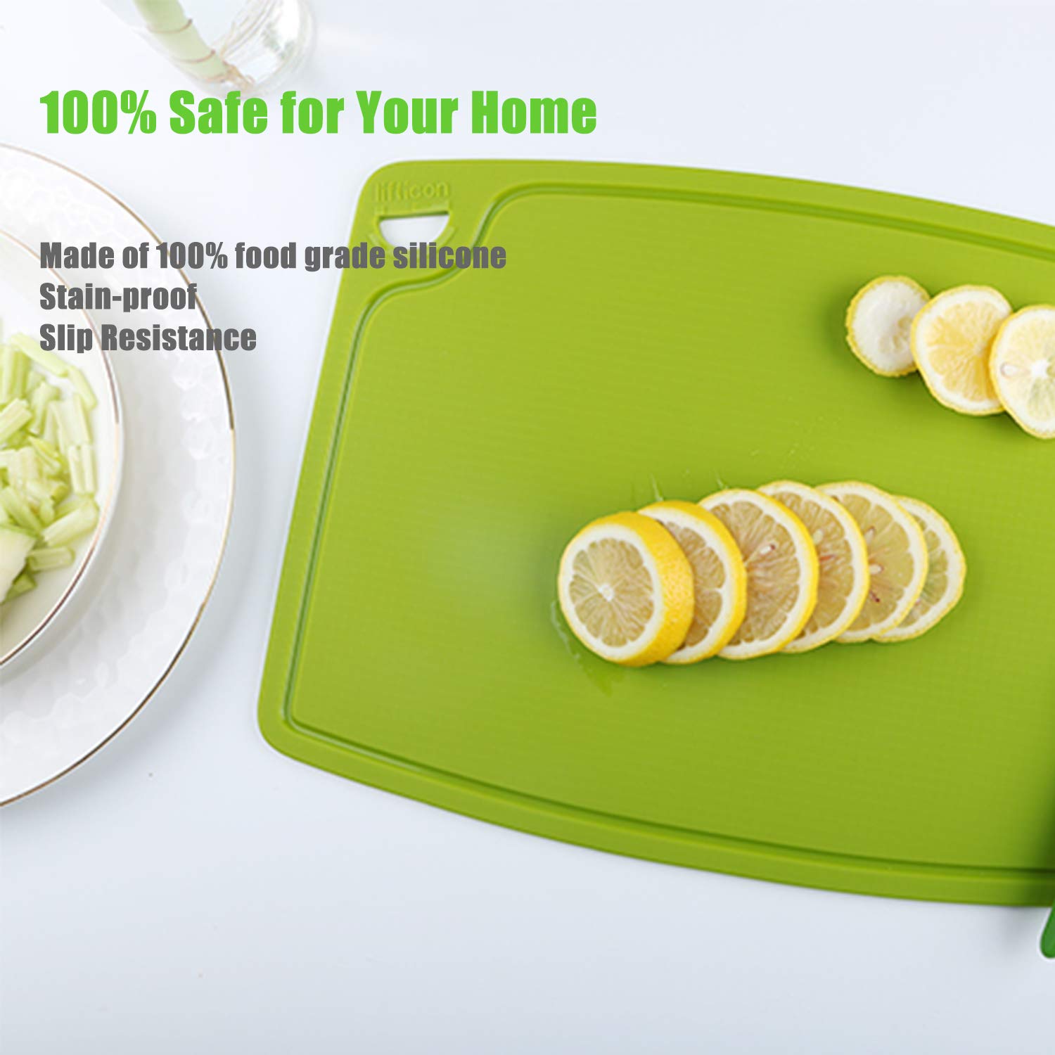 Green silicone cutting board with sliced lemons on a white surface