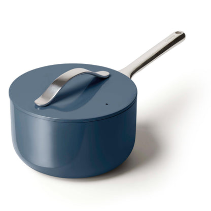 Blue saucepan with a silver handle on a white background