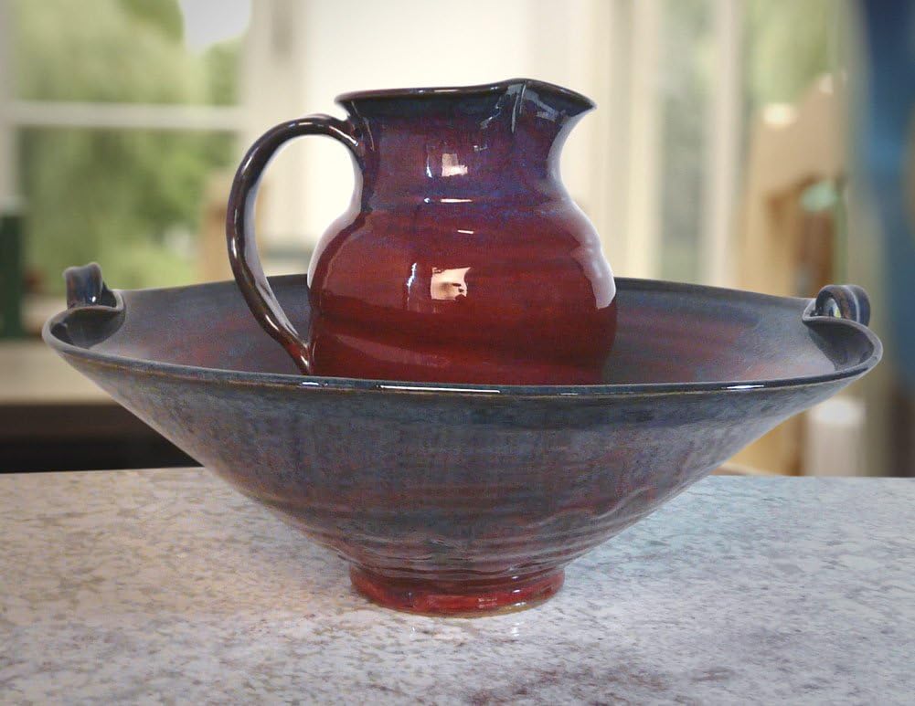 Modern Artisans Plum Perfect Stoneware Serving Bowl (2.5-Quart) on a marble surface with a blurred background