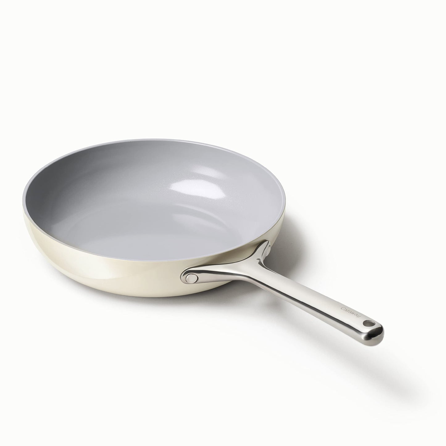 Gray frying pan with a white handle on a white background
