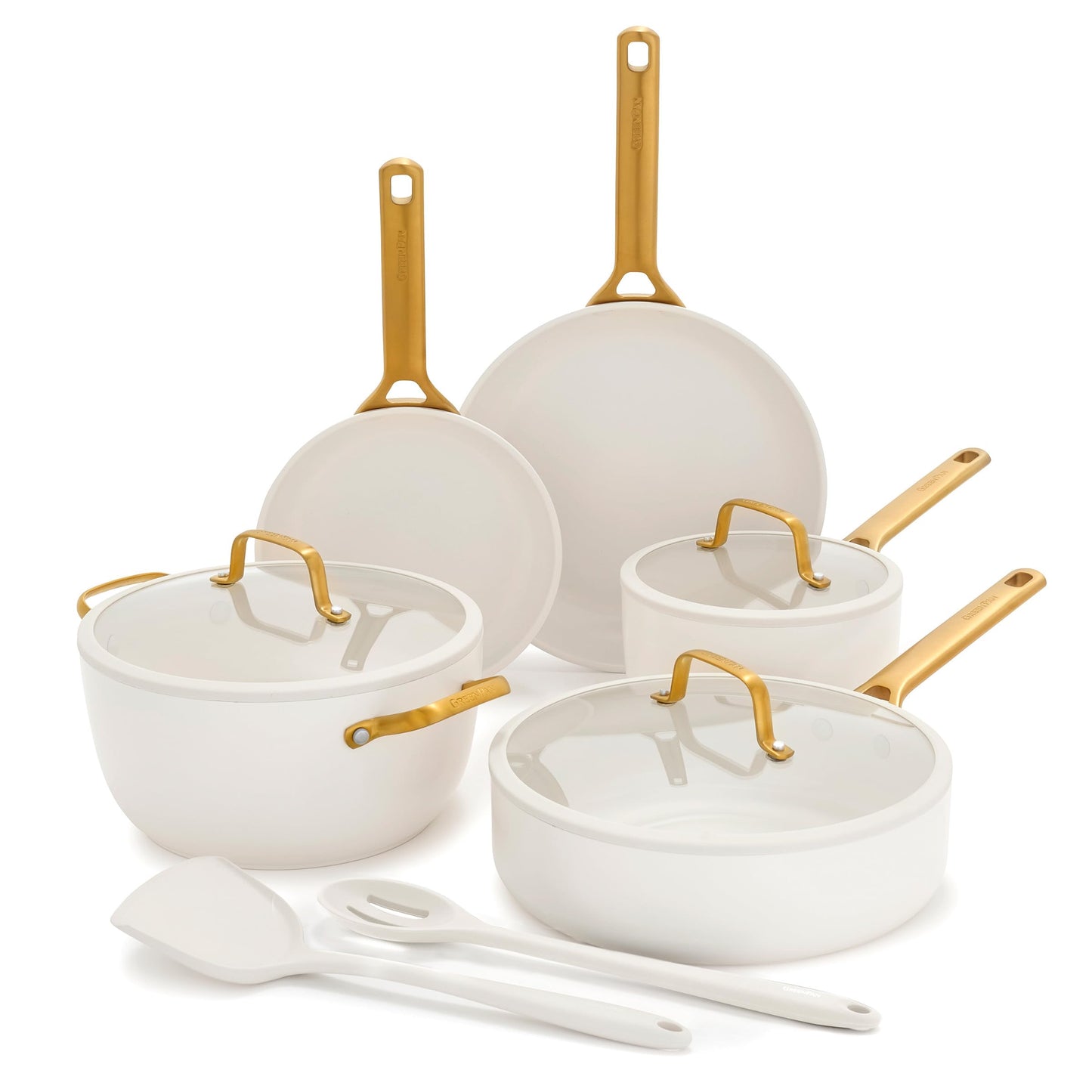 Set of white cookware with gold handles on a white background