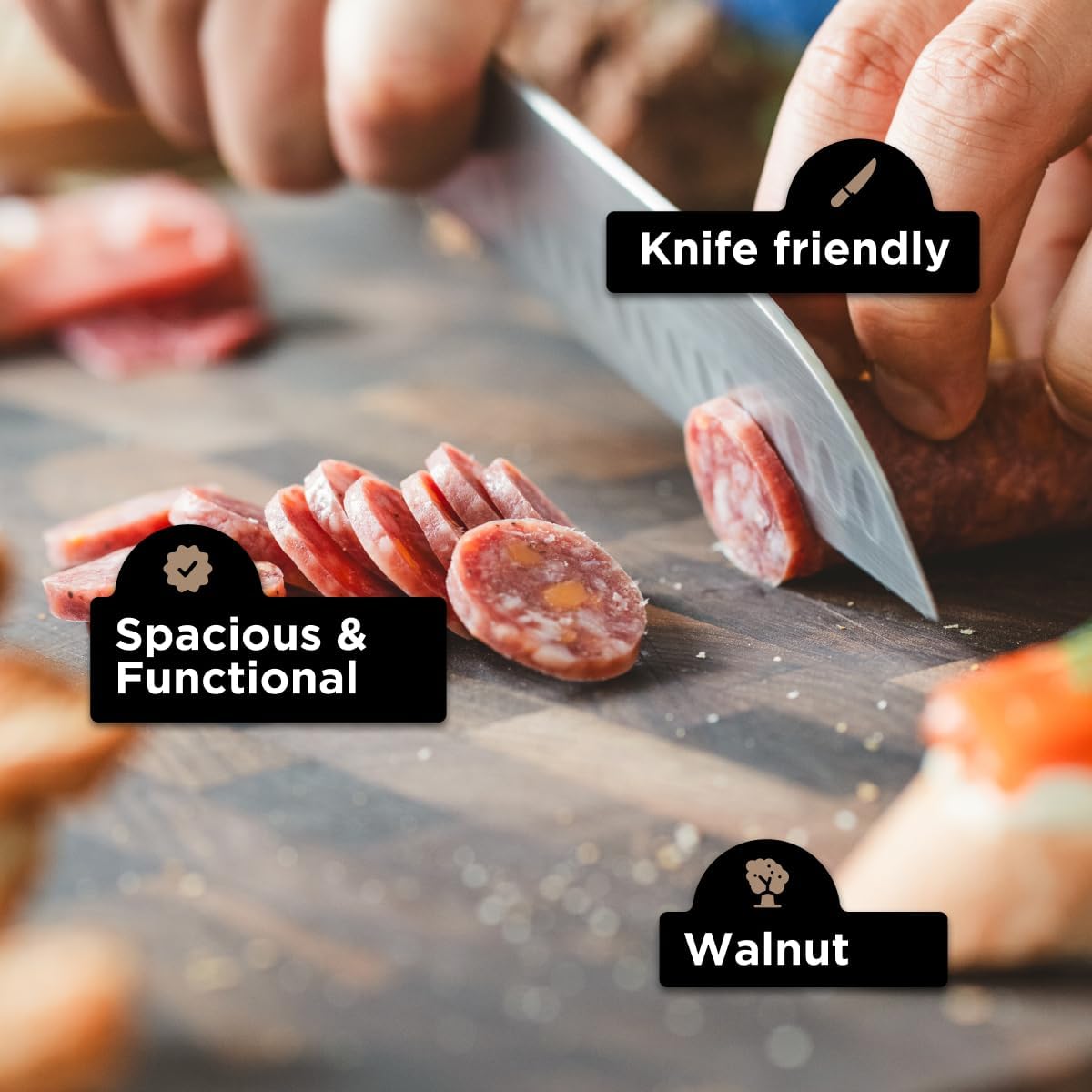 Person slicing salami on a wooden cutting board with text labels 'Knife friendly', 'Spacious & Functional', and 'Walnut'.