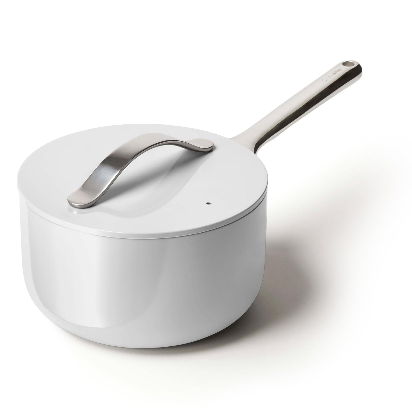 White saucepan with a silver handle on a white background