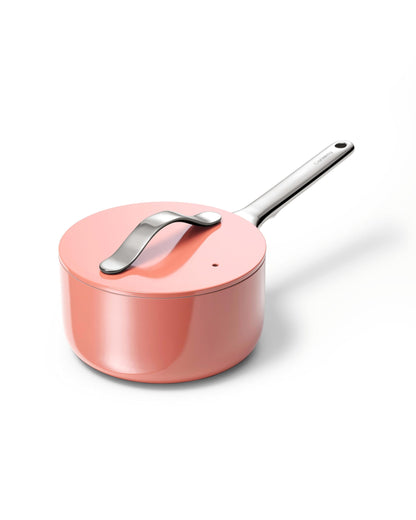 Pink saucepan with a silver handle on a white background