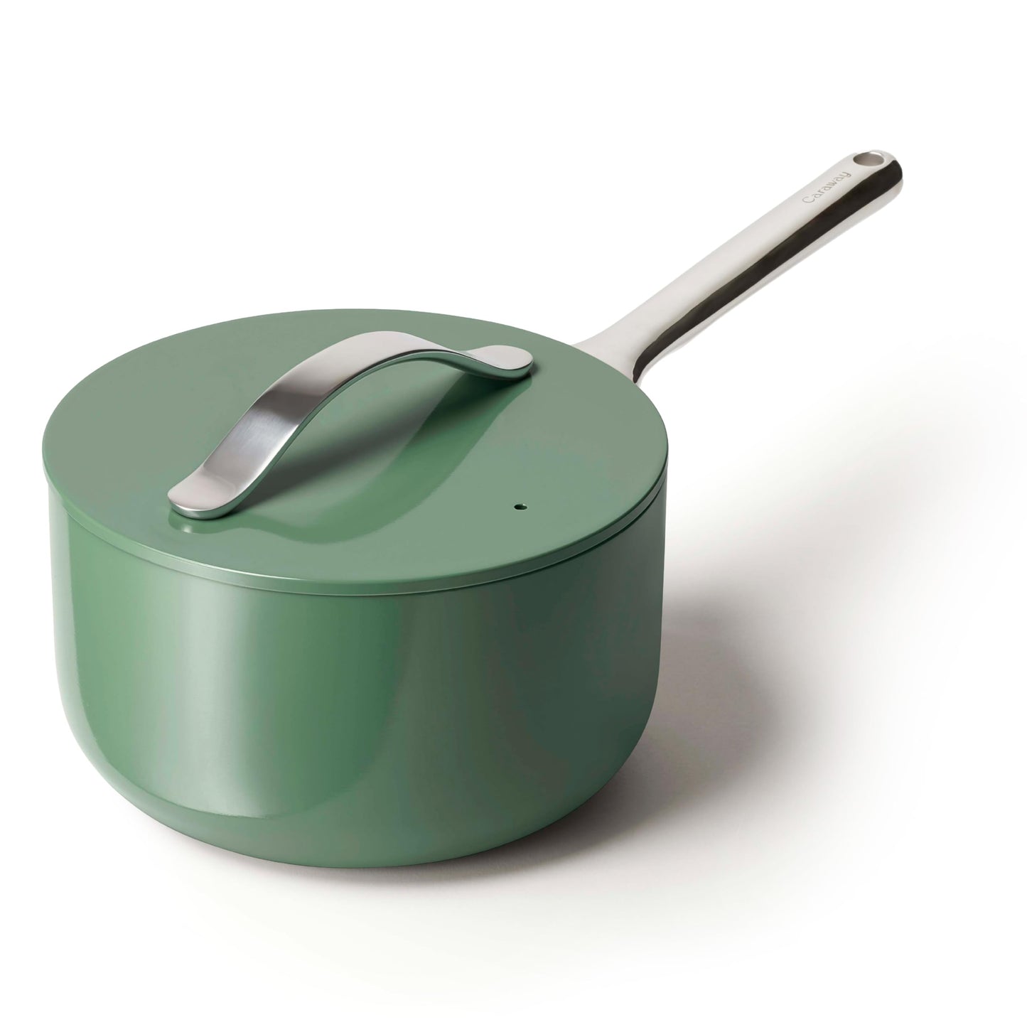 Green saucepan with a silver handle on a white background