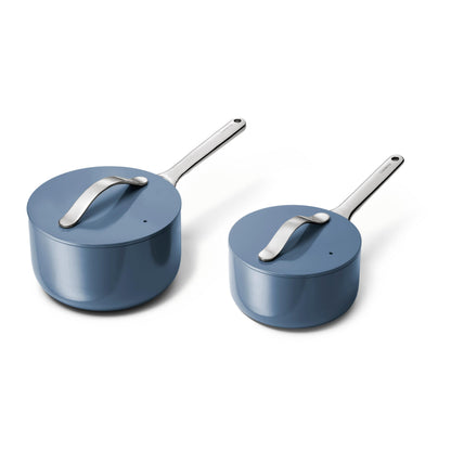 Two blue cookware pots with silver handles on a white background