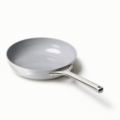 Gray frying pan with a stainless steel handle on a white background