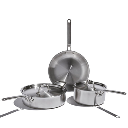 Set of stainless steel cookware on a white background
