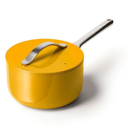Yellow saucepan with a silver handle on a white background