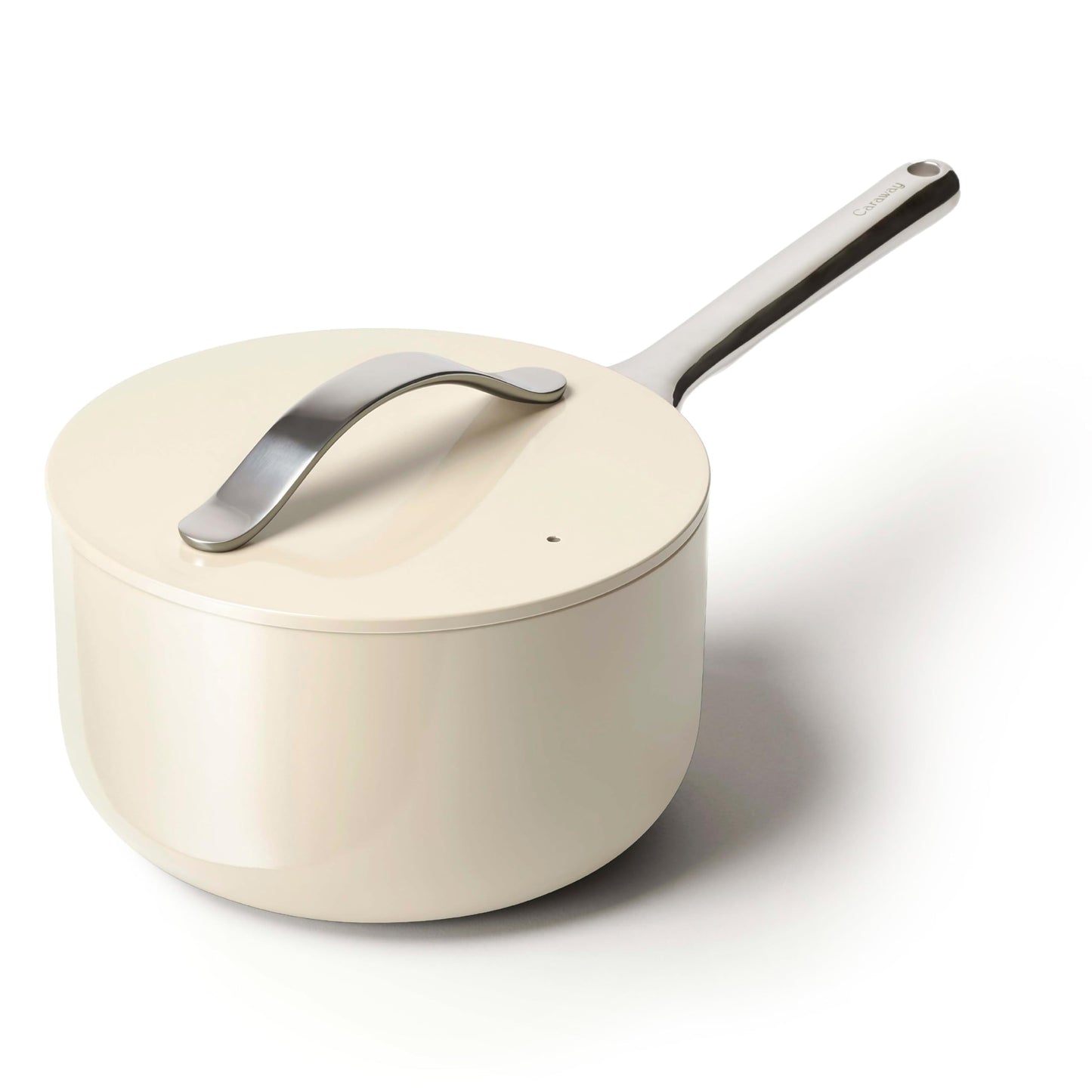 Cream-colored saucepan with a silver handle on a white background