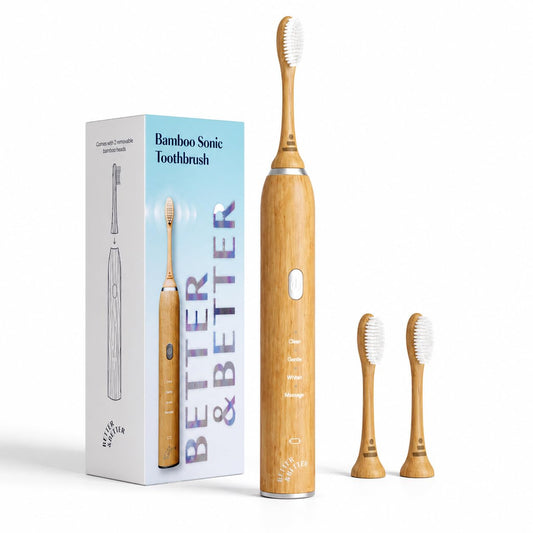 Bamboo sonic toothbrush with packaging and additional brushes on a white background