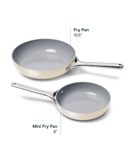 Two frying pans with measurements on a white background