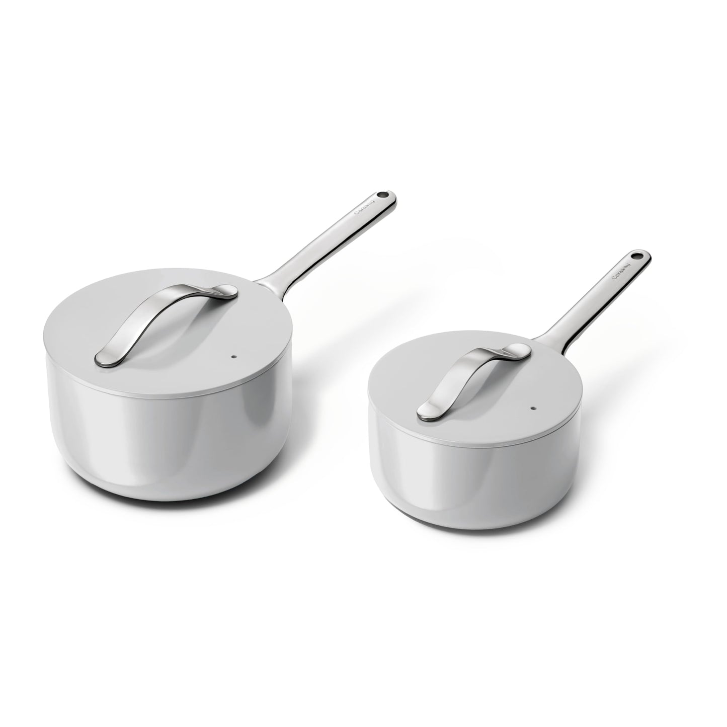 Two stainless steel saucepans with lids on a white background