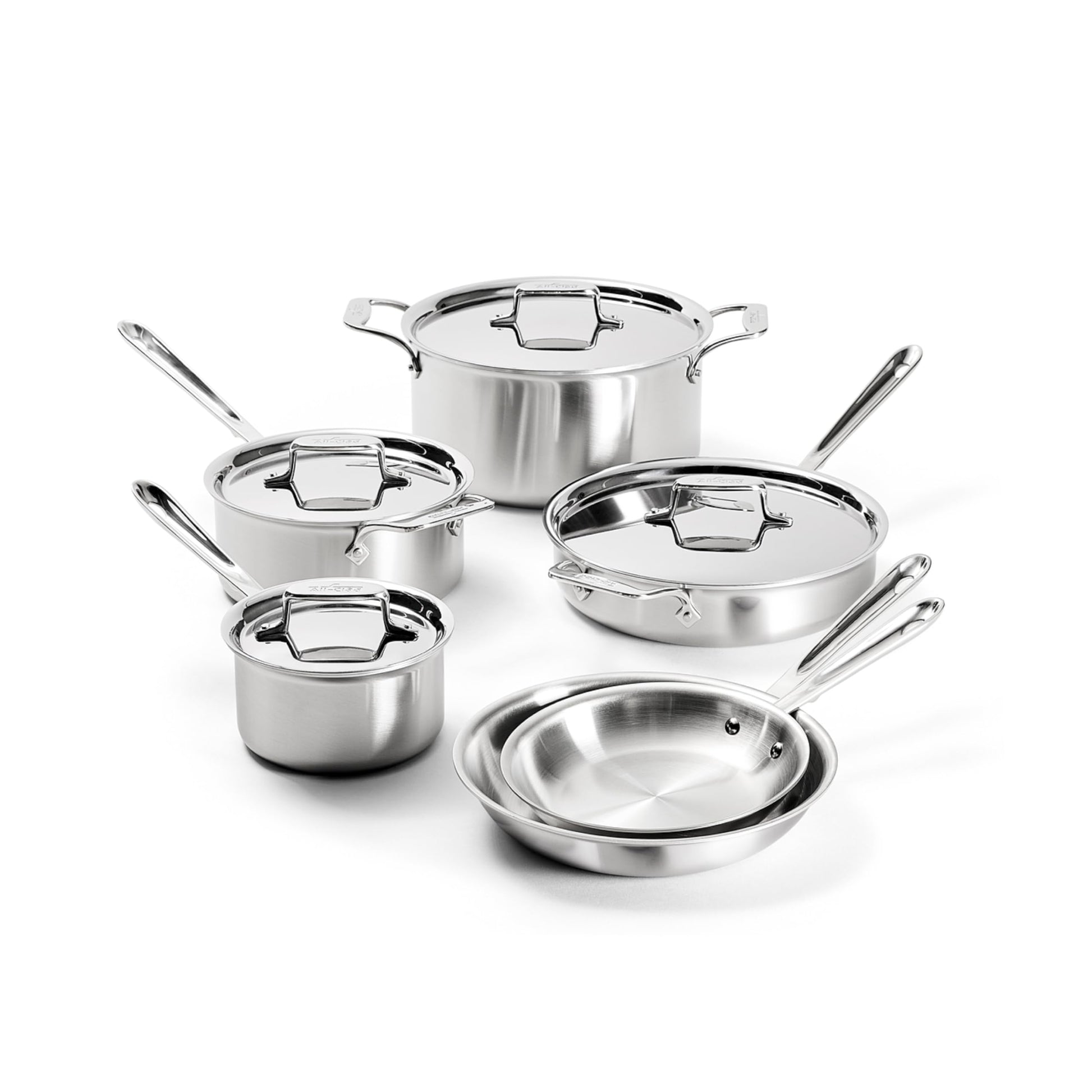 Set of stainless steel cookware on a white background