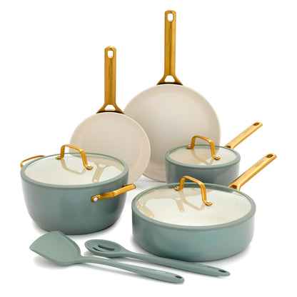 Set of cookware with gold handles on a white background