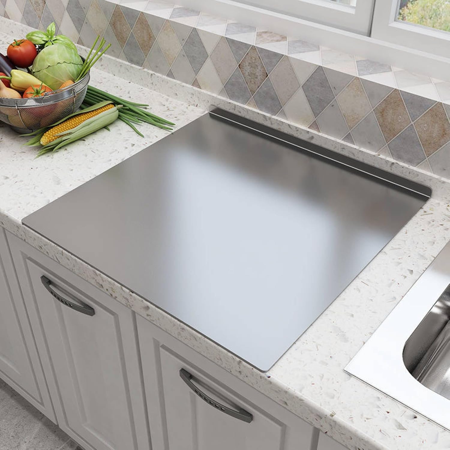 Stainless steel cutting boards on a countertop with vegetables in the background