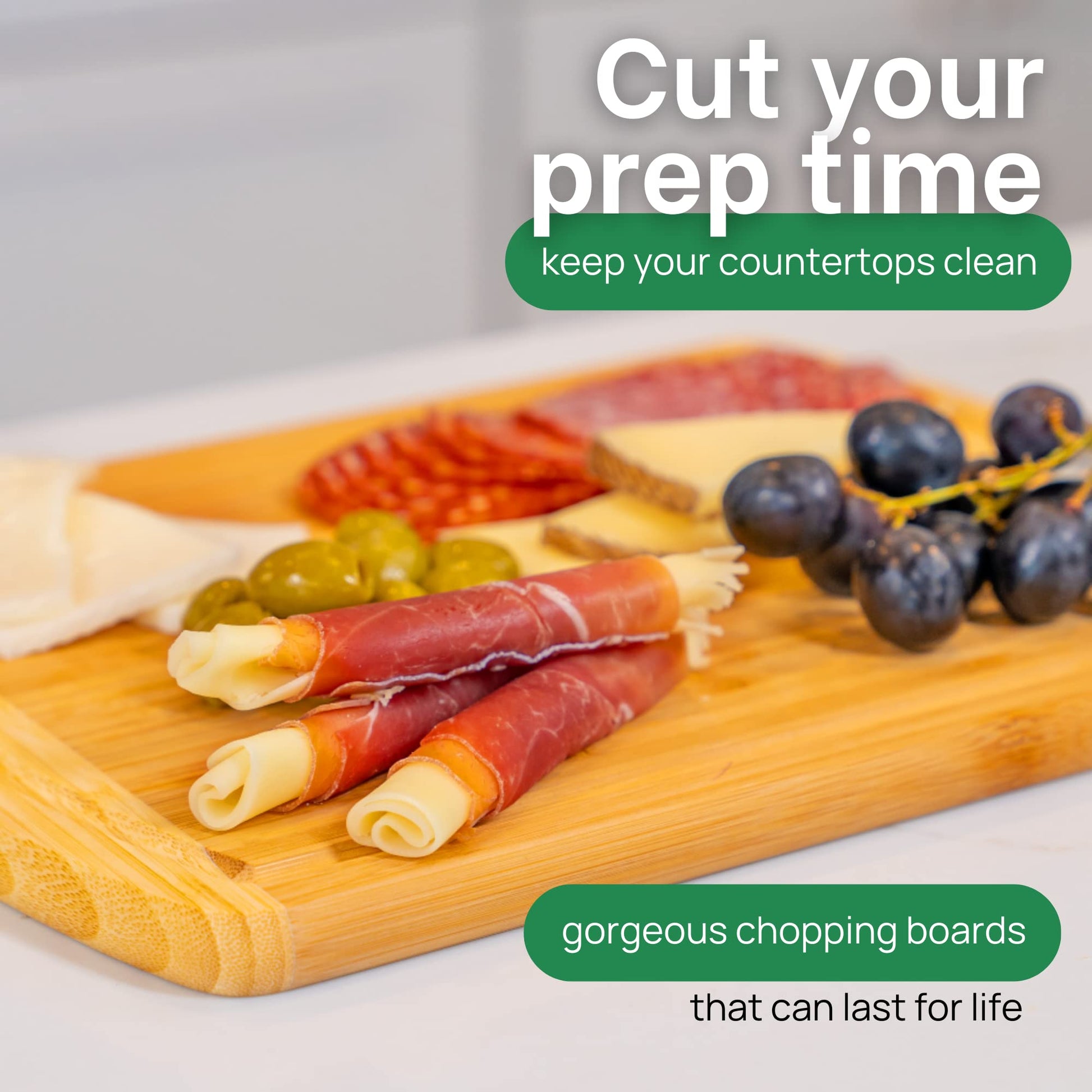 Wooden cutting board with cured meats, olives, and cheese on a light background