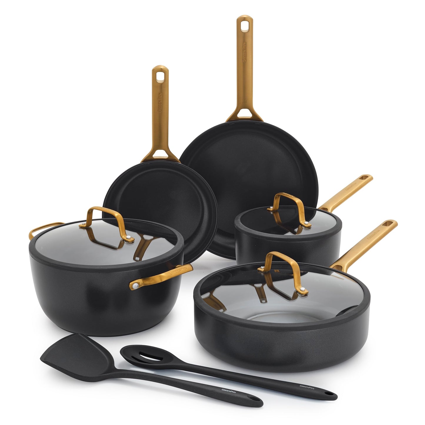Set of black cookware with gold handles on a white background