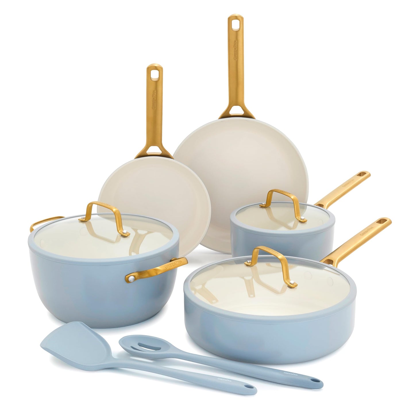Set of ceramic cookware with gold handles on a white background