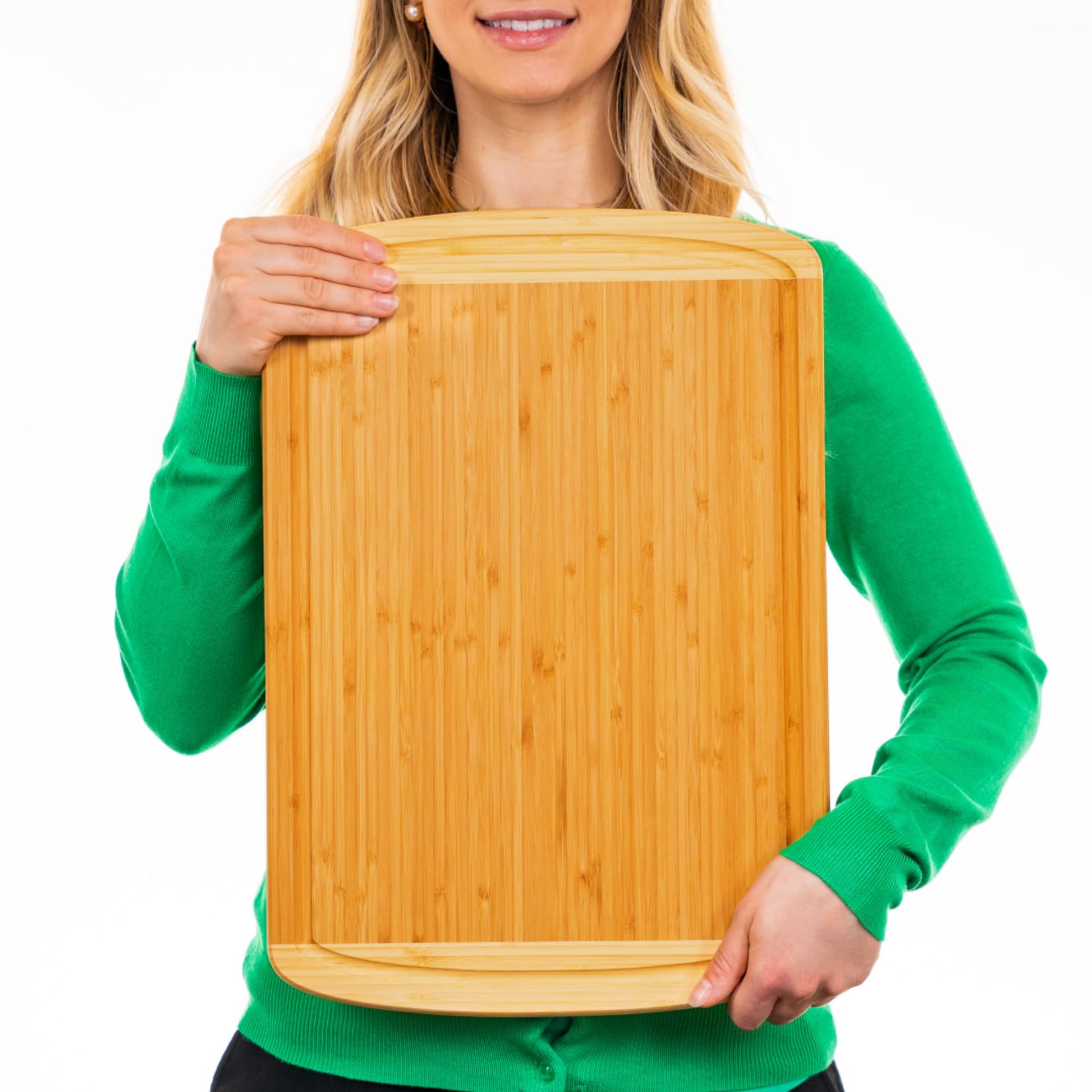 Person holding a wooden cutting board against a white background