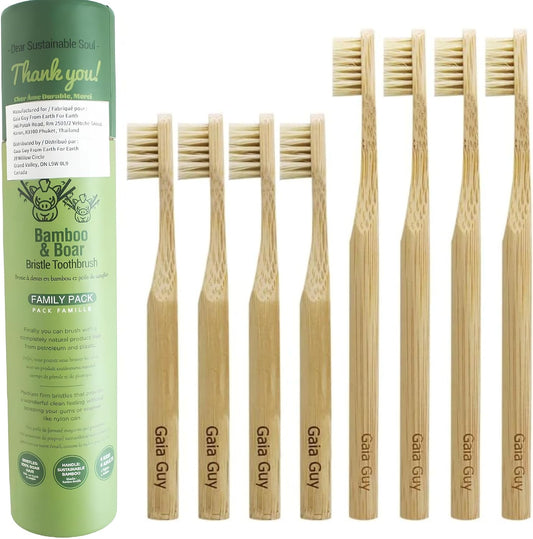 Set of bamboo toothbrushes with a green packaging labeled 'Gaia Guy' on a white background.