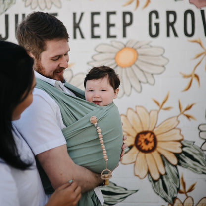 Mushie Organic Cotton Baby Wrap: Soft Roman Green Sling