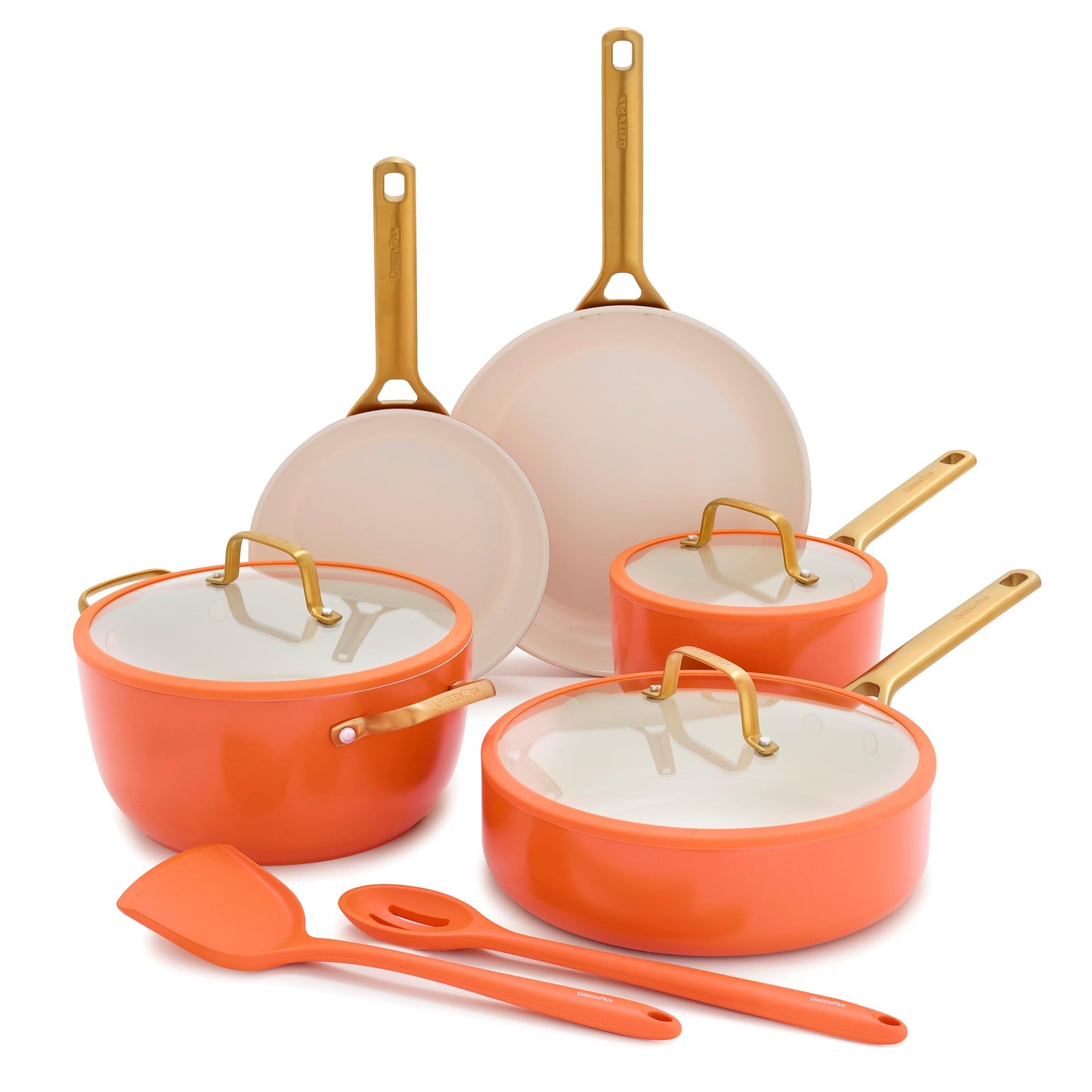 Set of orange and beige cookware with gold handles on a white background