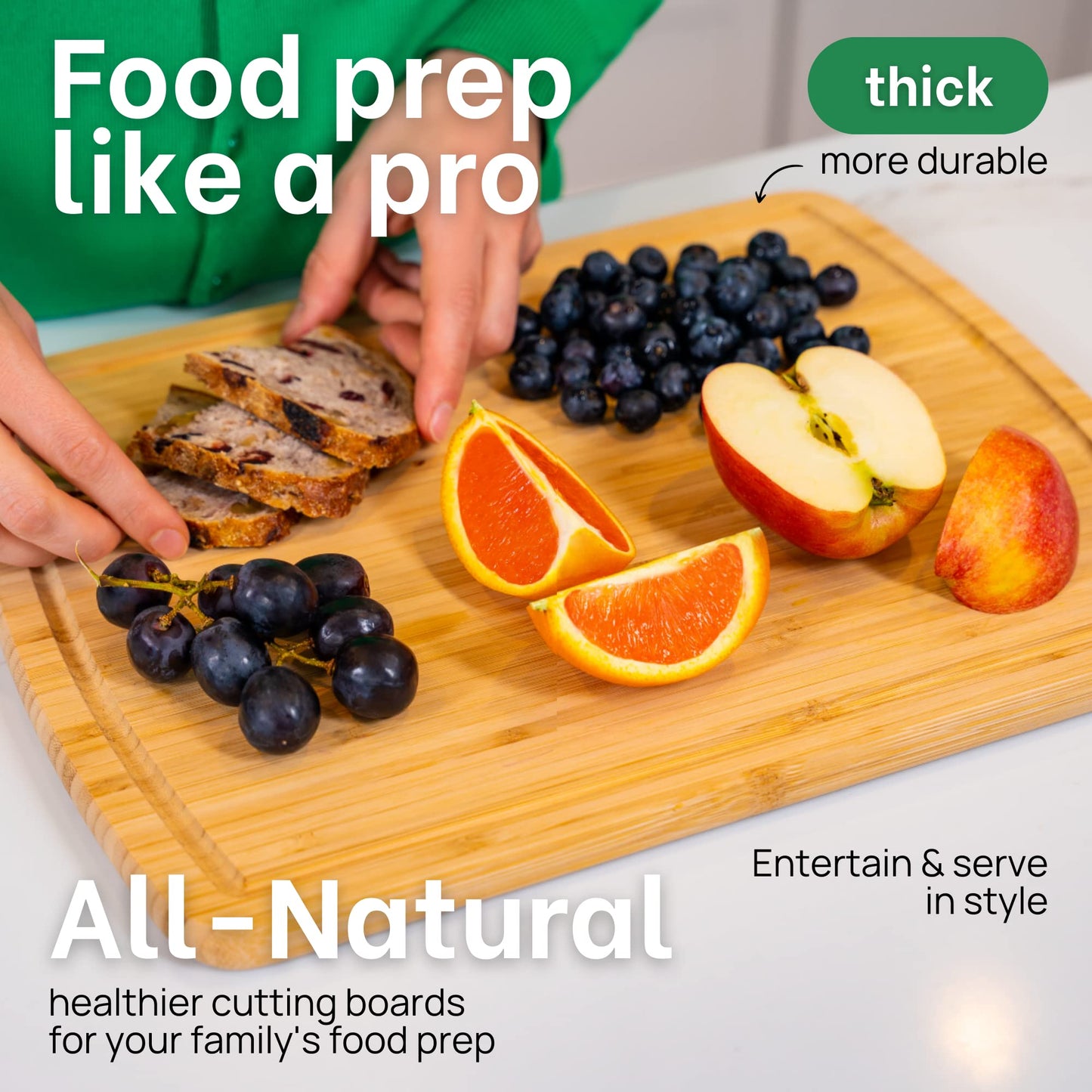 Person preparing food on a wooden cutting board with fruits and bread, text about thick durable cutting boards.