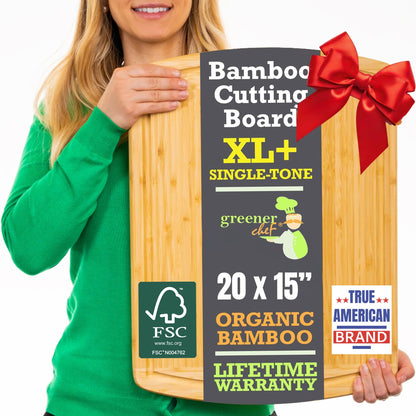 Person holding a bamboo cutting board with a red bow, featuring product details on a white background.