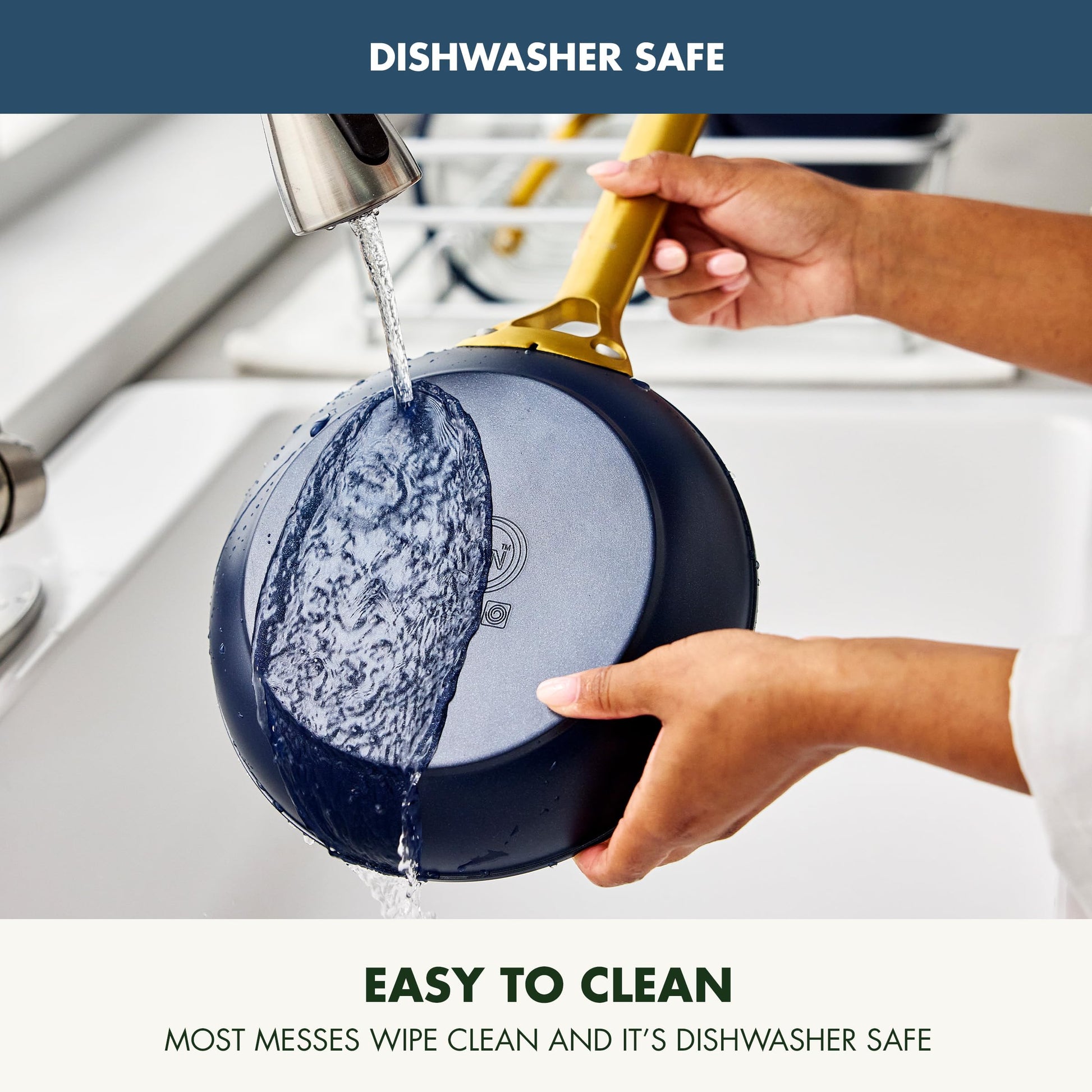 Person rinsing a blue and black pan under running water with text indicating dishwasher safety and ease of cleaning.