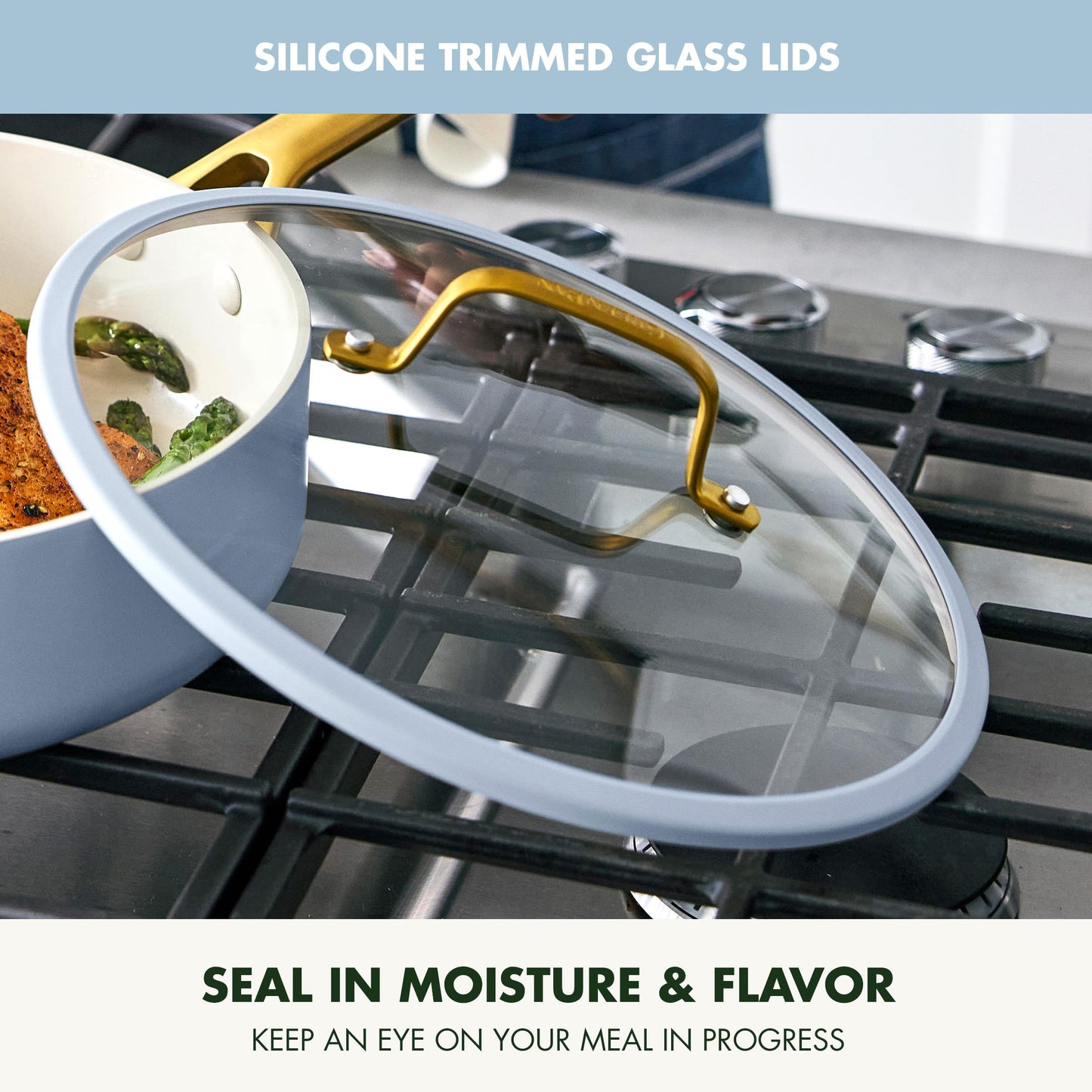 Glass lid with silicone trim on a stove, showing food inside.