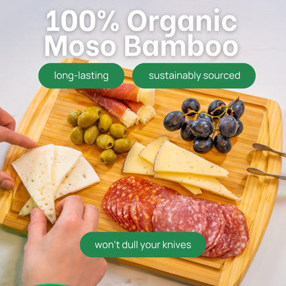 Wooden cutting board with cheese, salami, olives, and grapes, labeled '100% Organic Moso Bamboo'.