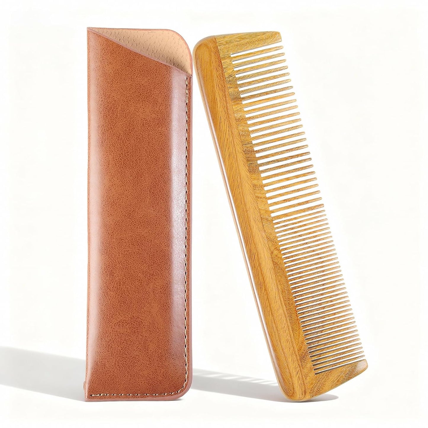 Wooden comb and brown leather case on a white background