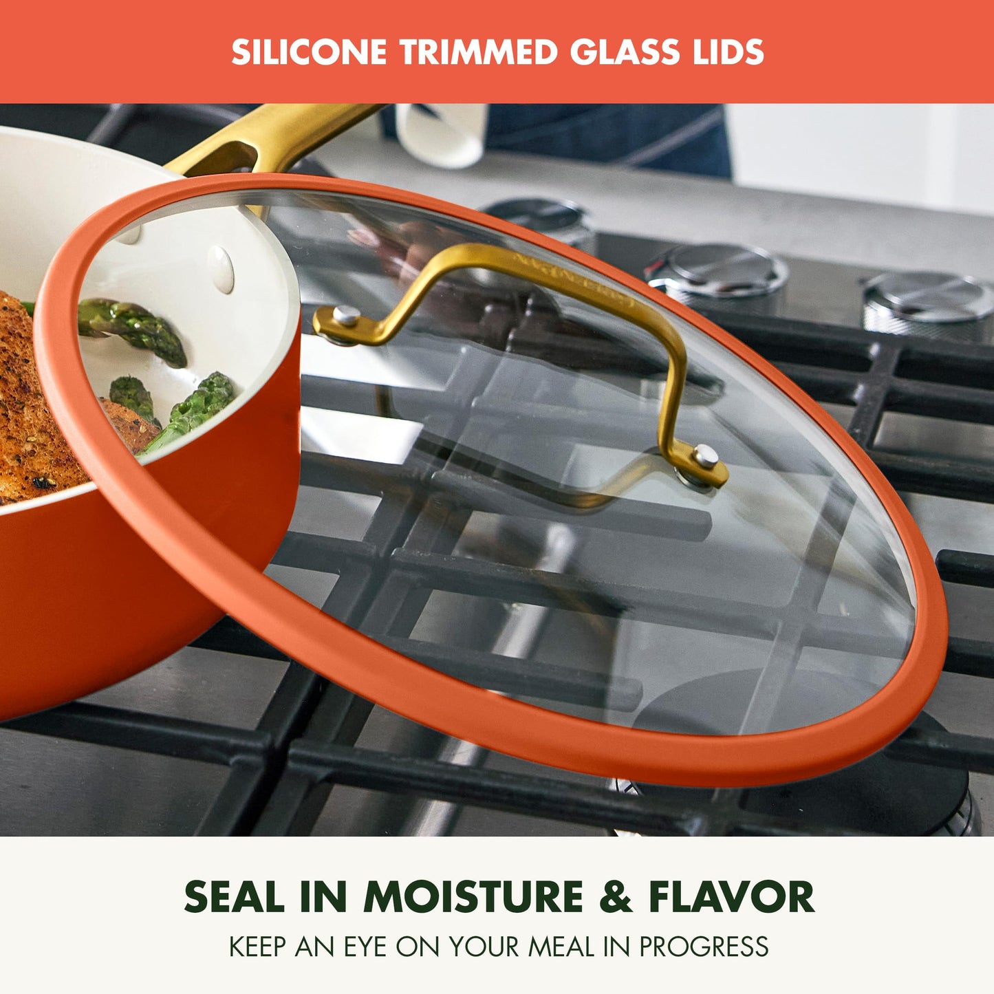 Ceramic pot with glass lid on a stove, featuring silicone trim.