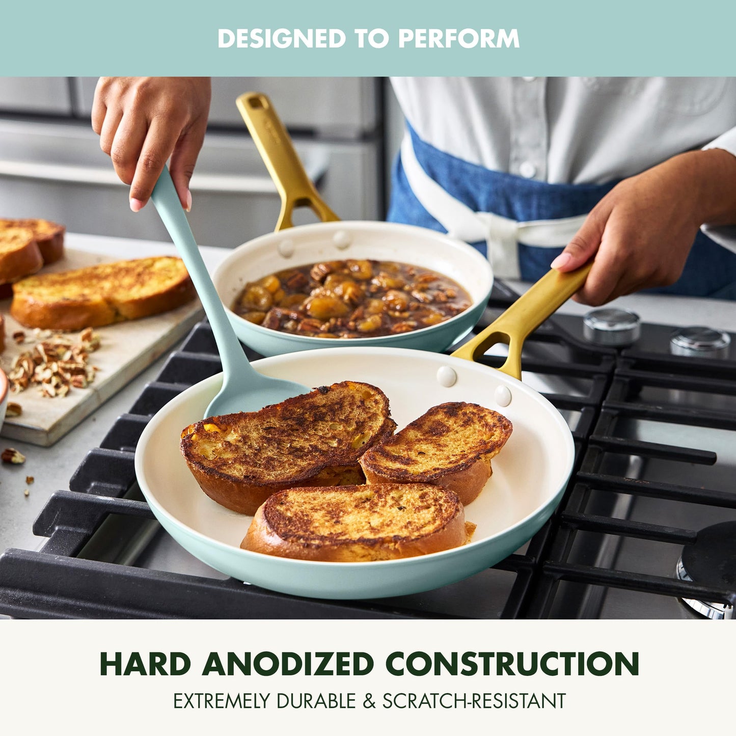Person cooking on a stove with pans and food, highlighting hard anodized construction.