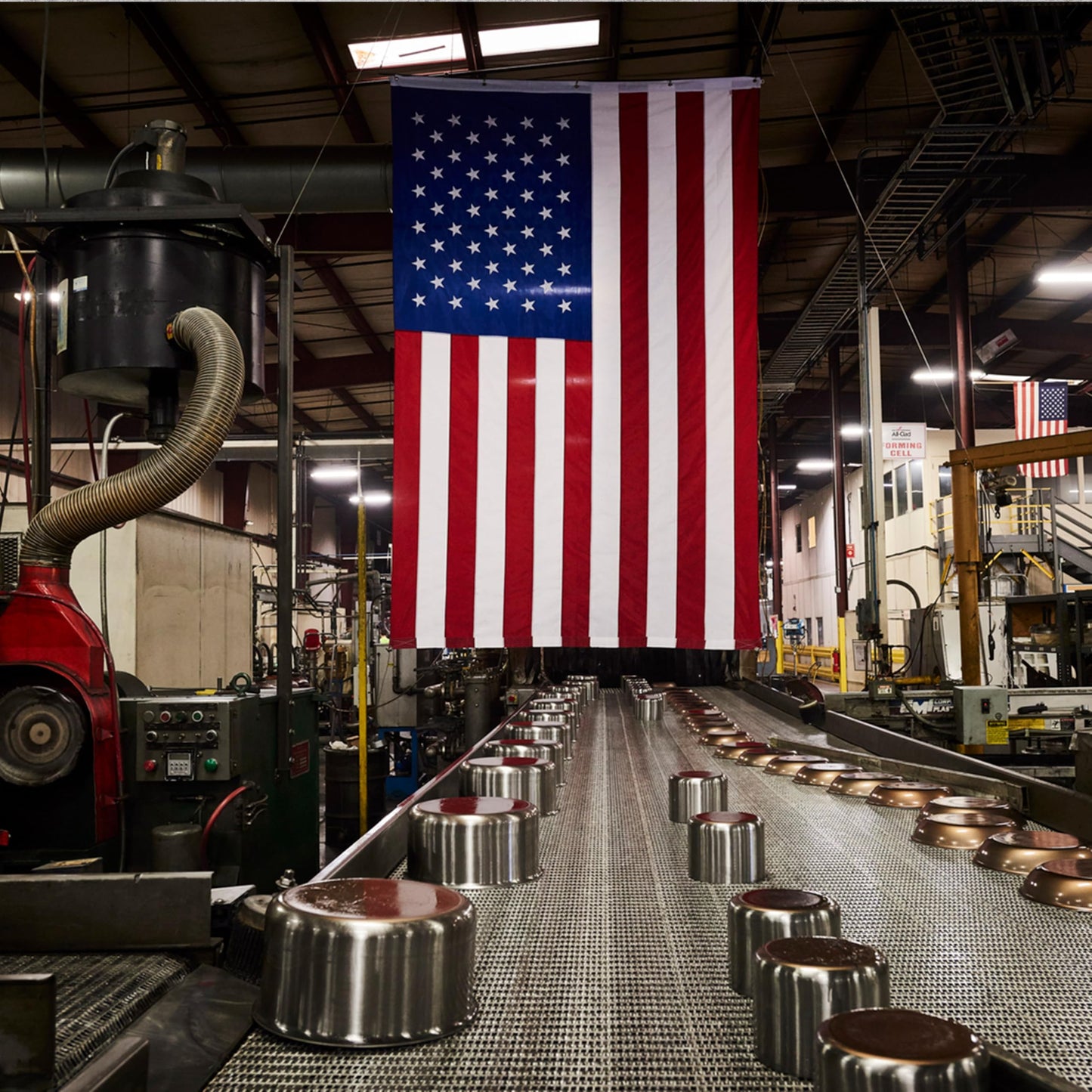 Factory interior with an American flag hanging from the ceiling